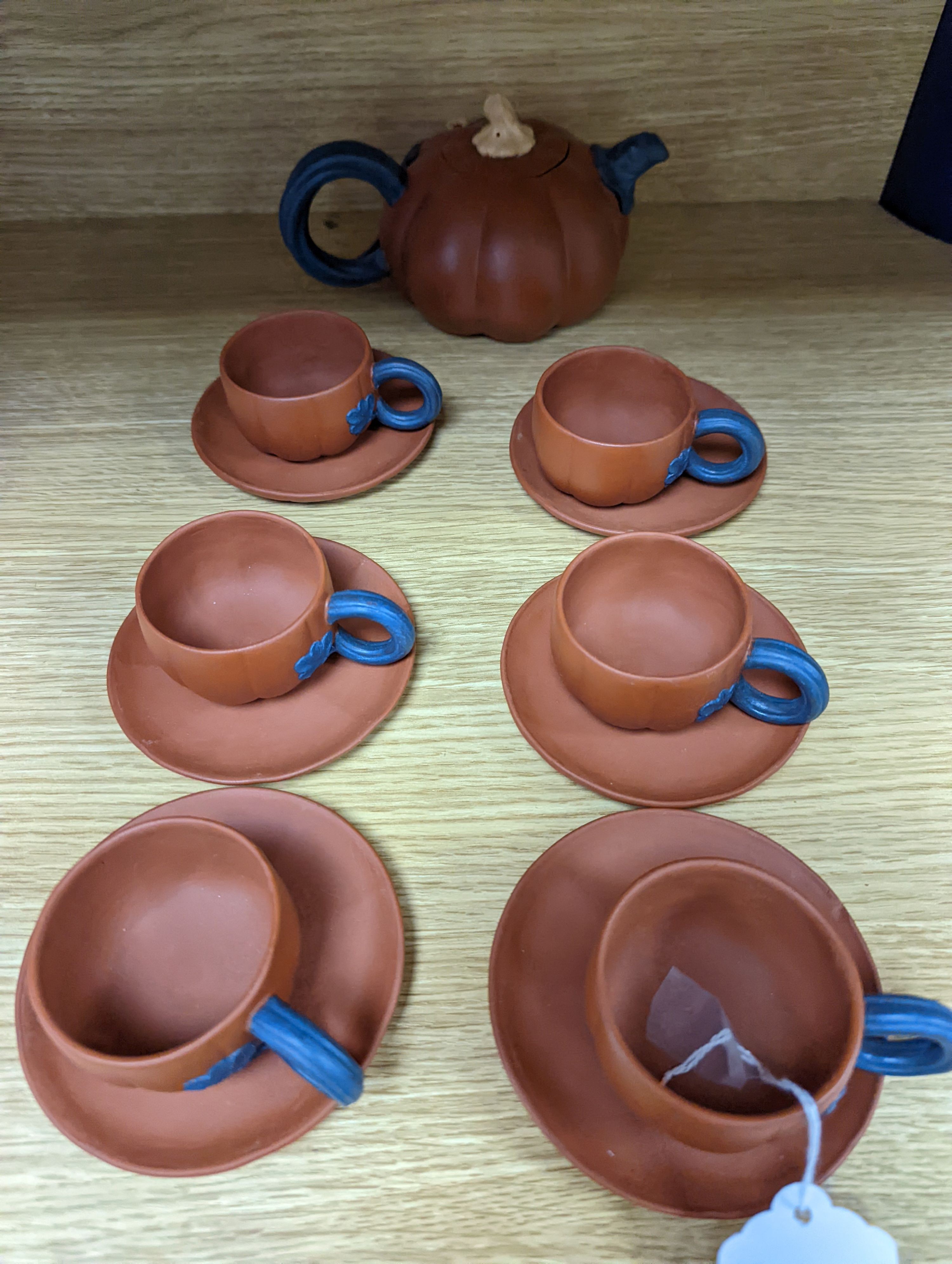 A Chinese Yixing pottery tea set